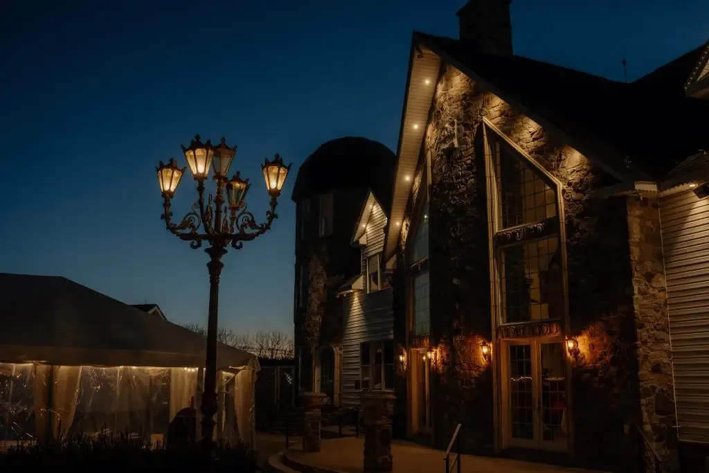 The mansion lit at night