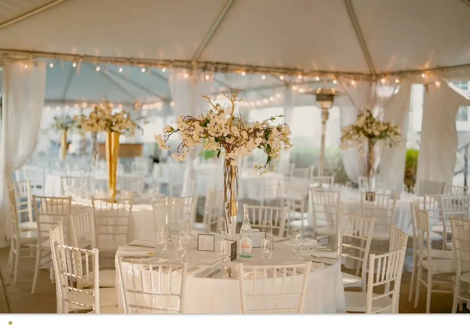Reception tables set under the tent